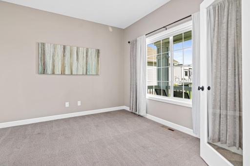 The main floor office features a glass French door and overlooks the front porch.