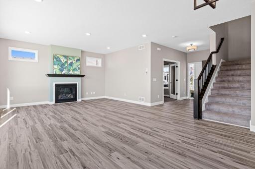 The main floor boasts brand new luxury vinyl flooring that was extended into the living room, replacing the living room carpet and creating a unified space.