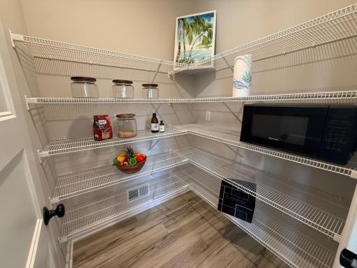 A spacious walk-in pantry is the perfect finishing touch to the kitchen!