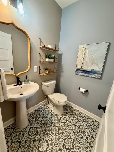 The main floor half bath is perfectly situated off the mudroom.