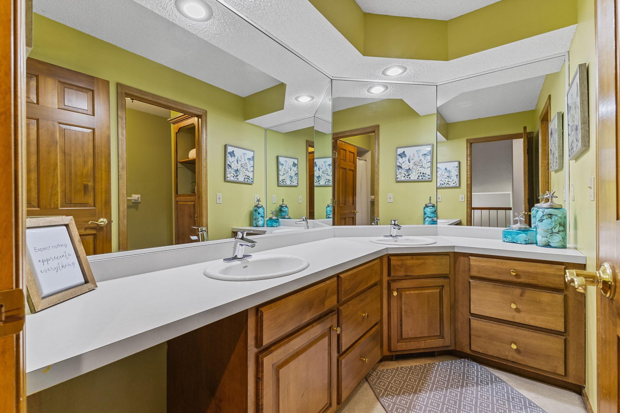 Main bathroom with separate vanity and dual sinks for busy mornings.