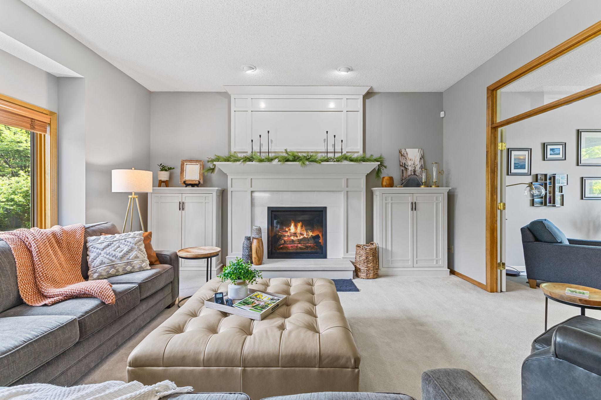 This exceptional custom fireplace surround and adjacent cabinetry delivers an incredible focal point! (2019)