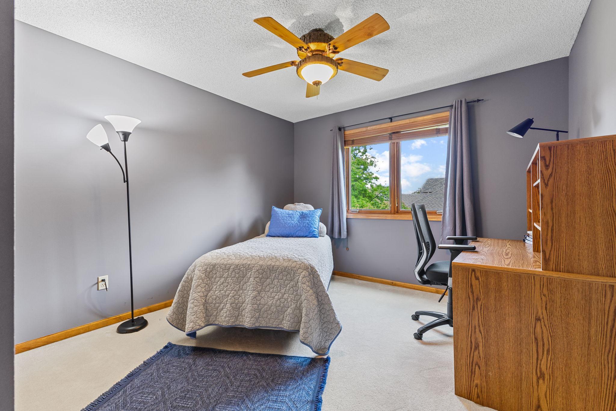 Bedroom 3 on the upper level. All bedrooms with ceiling fans for all year comfort.