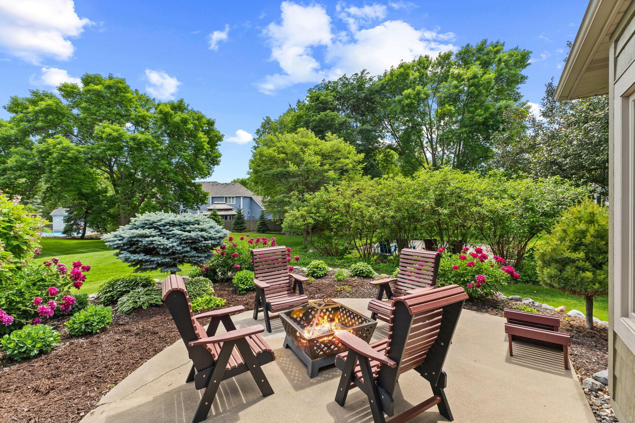 Surrounded by established perennials this easy access patio offers a perfect extension for entertaining or family bonfires & endless conversation.