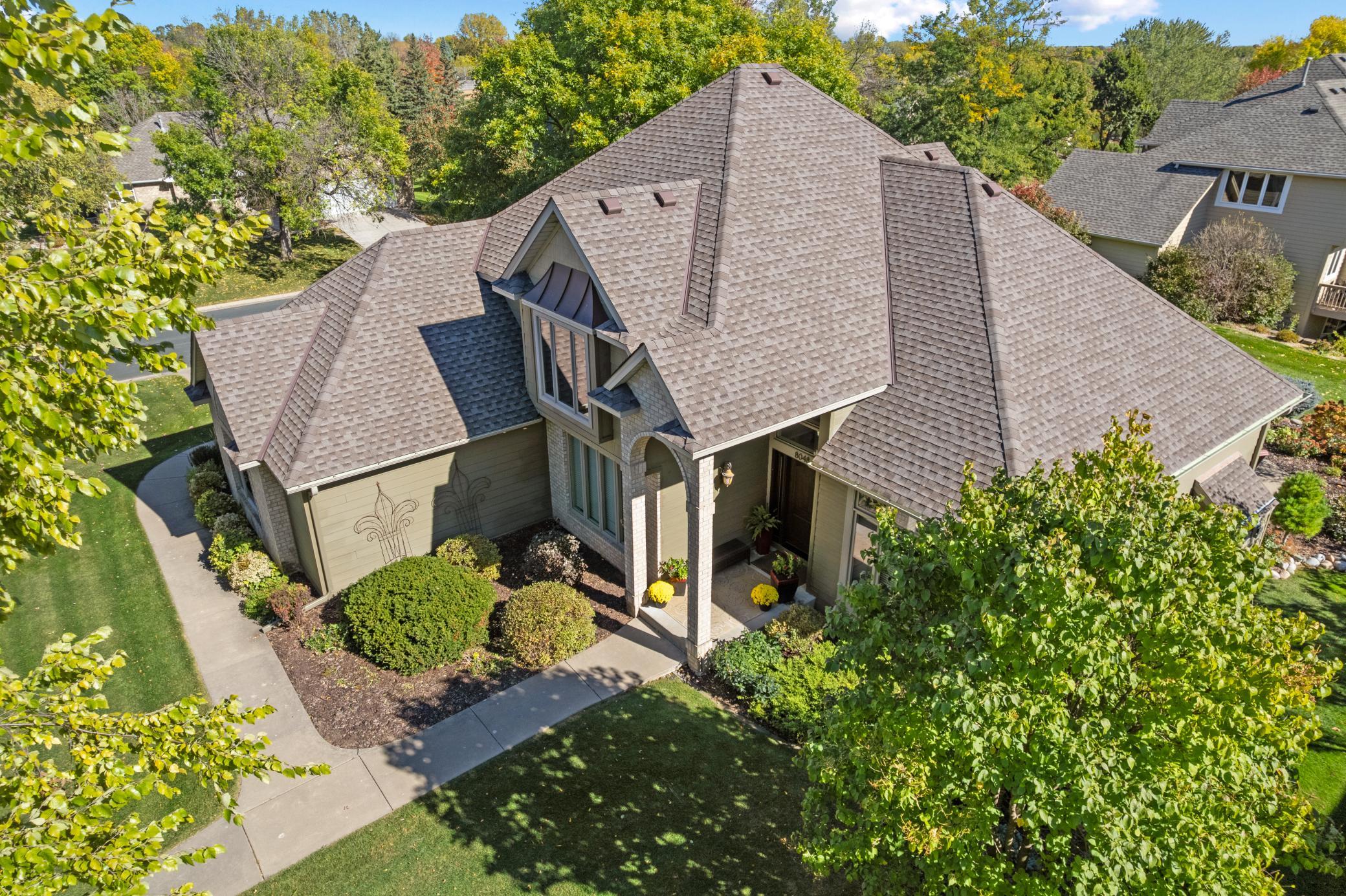 Live with peace of mind knowing the new roof, fascia & gutters (2020) will provide years of comfort. Additional exterior features include new LP siding (2017) a concrete driveway & walkway, full 8 zone irrigation and established landscape.