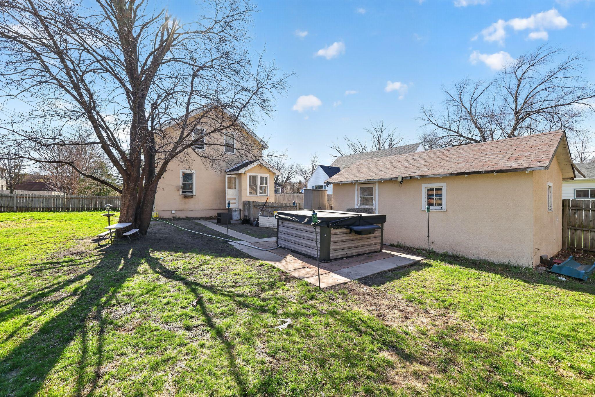 View of back of home. Hot tub does NOT stay, but wired for 220 for you to put one in.