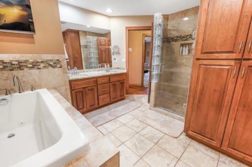 Double sink, tub, tiled shower