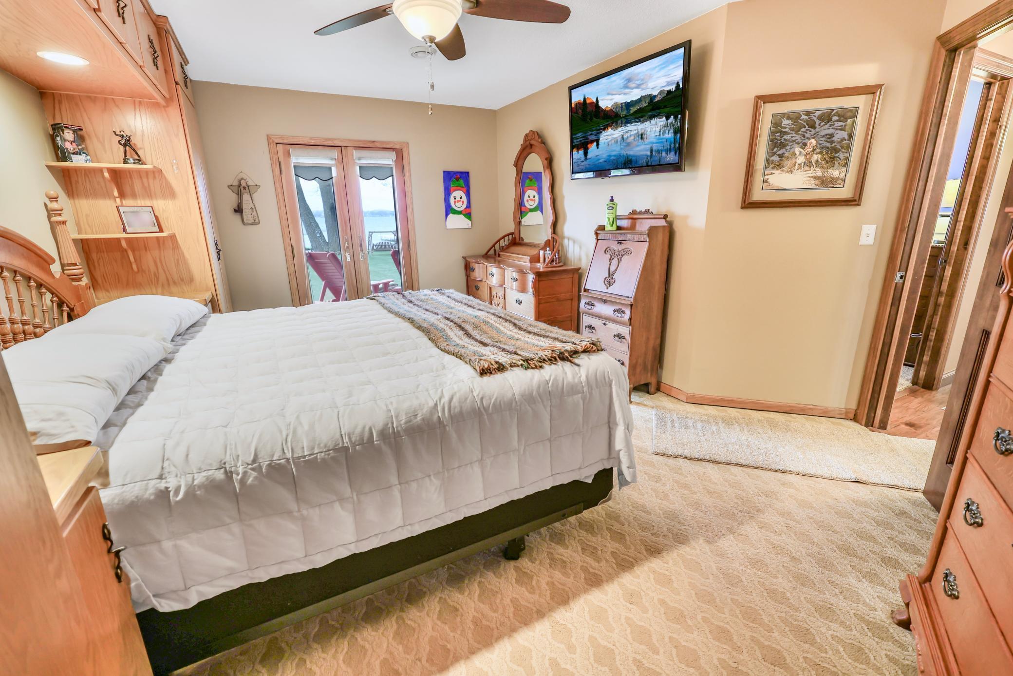 Primary with French doors to lakeside