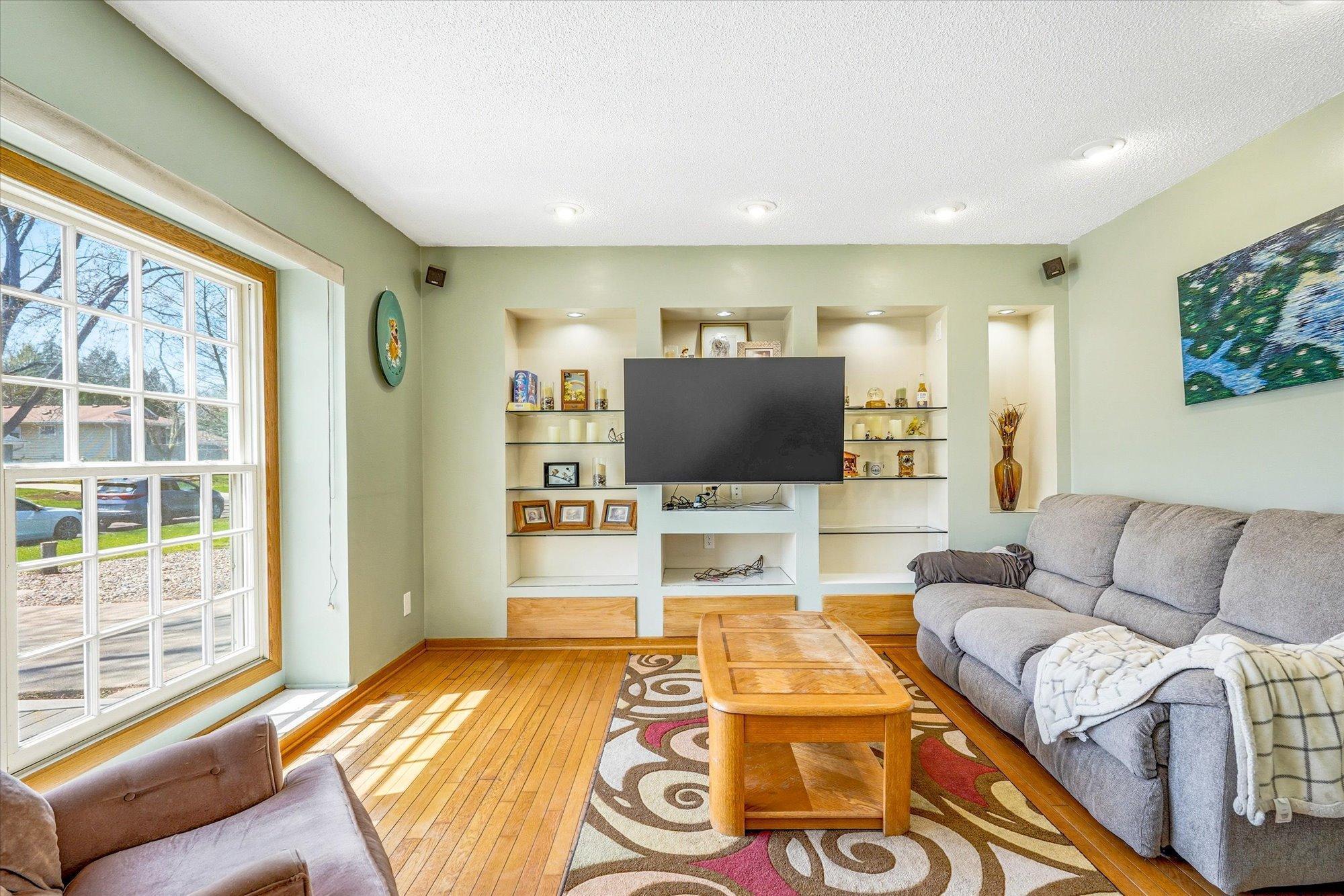 Custom shelving, accent lights, and surround sound