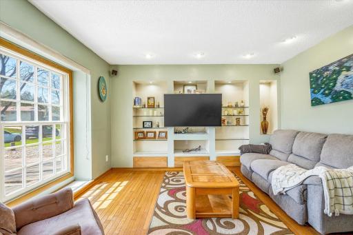 Custom shelving, accent lights, and surround sound