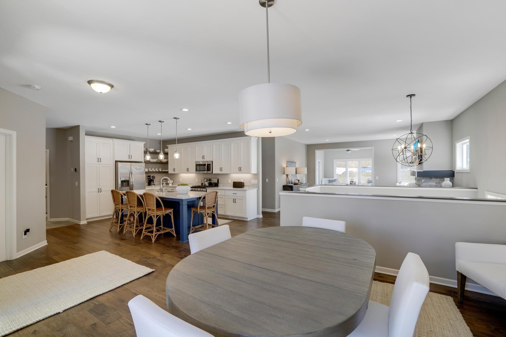At the center of it all is a gorgeous kitchen with a large island that naturally becomes the heart of the home, perfect for a quick breakfast or a place for friends to gather and chat.