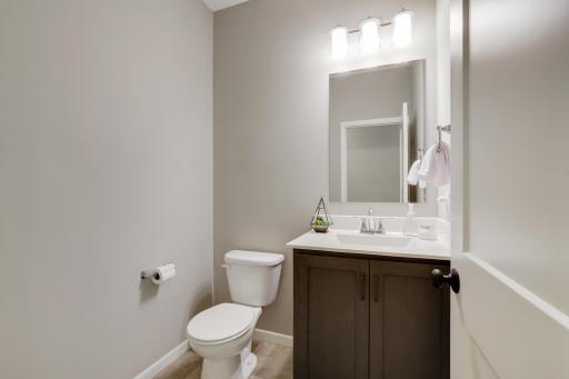 With the laundry room, a second bedroom, and a half-bath also located on this floor, the main level provides everything you need for daily life within reach.