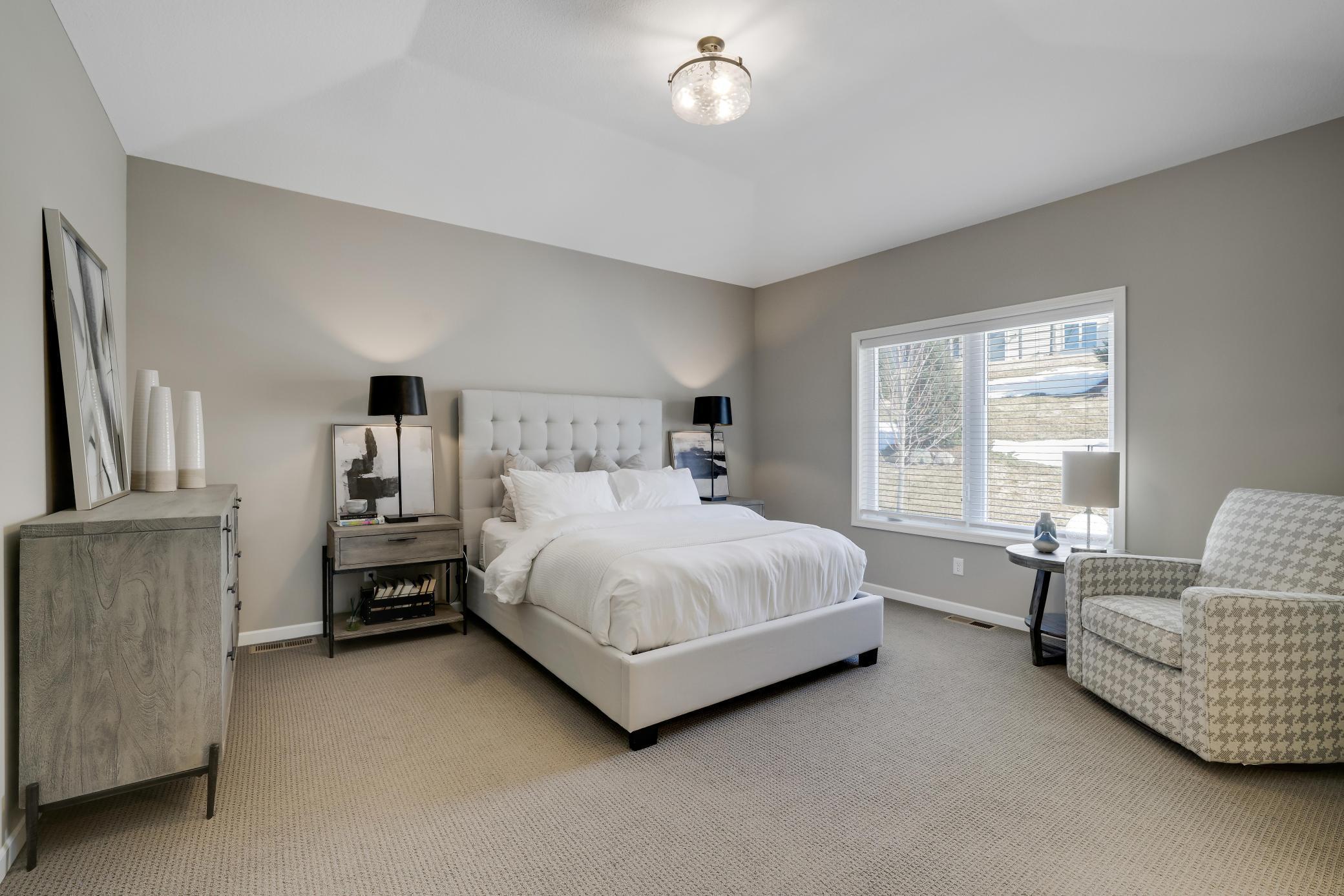 Welcome to your primary bedroom, a retreat for the long days where you can unwind and relax from the rest of the world.