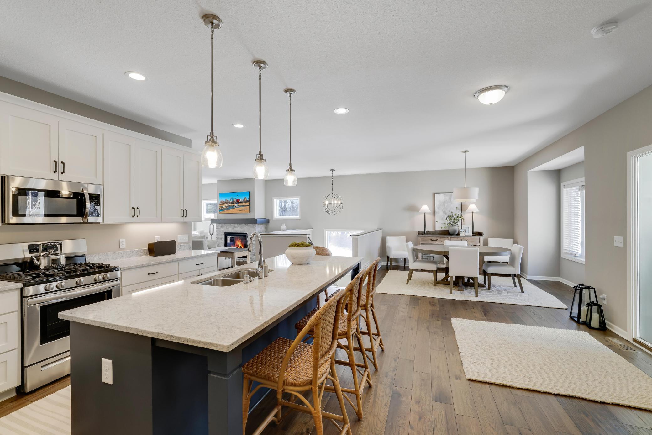 This executive townhome is part of one of the most sought-after pockets of the Prior Lake area, where the clean, modern look of the home sits right against a wall of mature trees and rolling hills.
