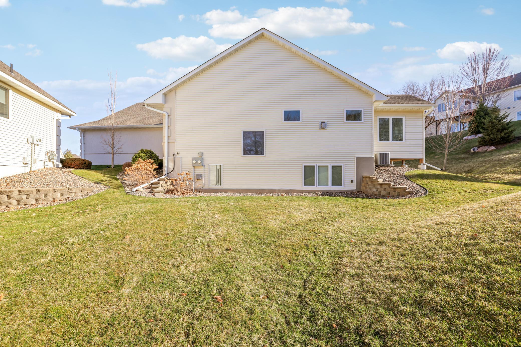 The sprawling side yard view, perfect for your family and friends to swing by and enjoy the day OUTSIDE here!
