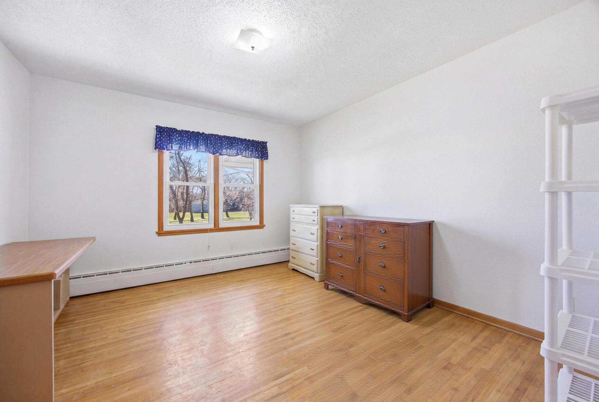 Bedroom 3 - Main Level (personal property digitally removed)