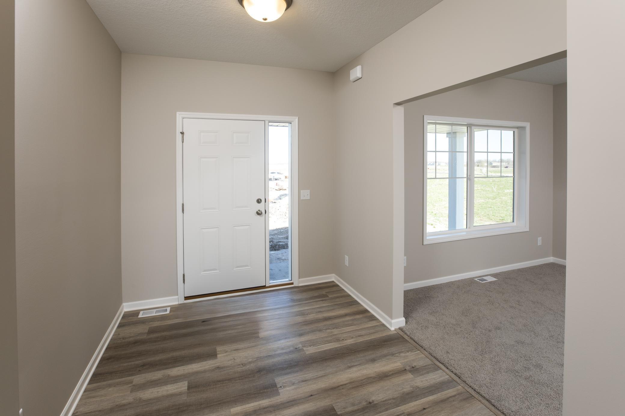 PHOTO OF A DIFFERENT HOME WITH SIMILAR PLAN. FINISHES MAY VARY. Foyer