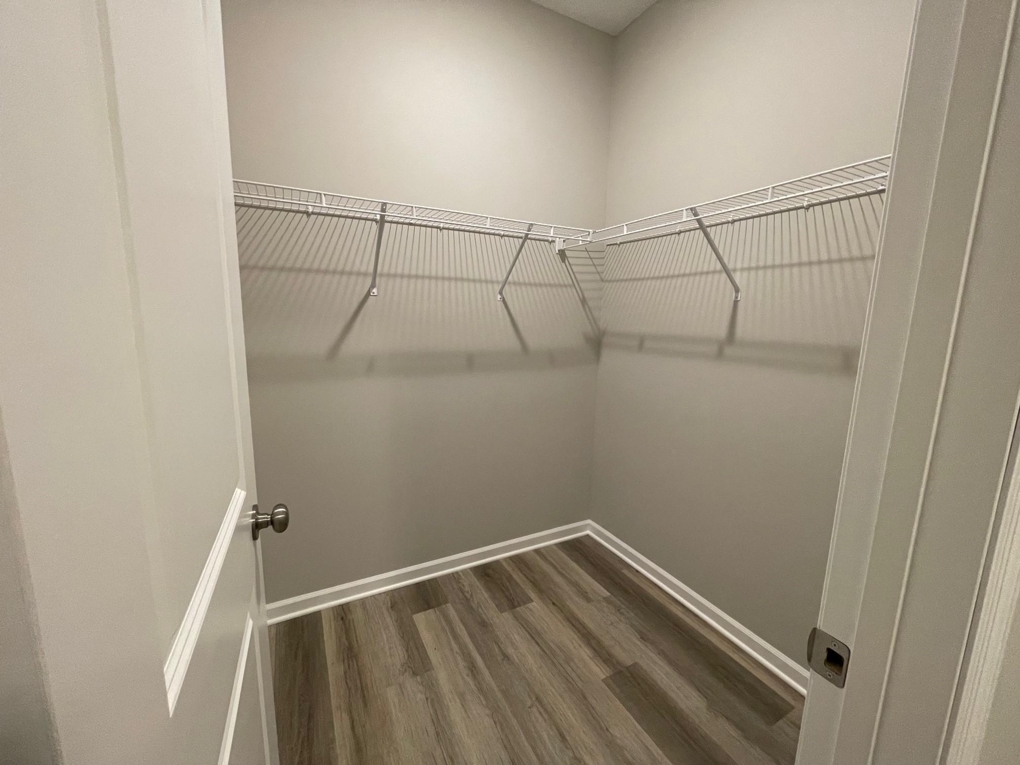 PHOTO OF A DIFFERENT HOME WITH SIMILAR PLAN. FINISHES MAY VARY. Mudroom features a Walk-in Closet.