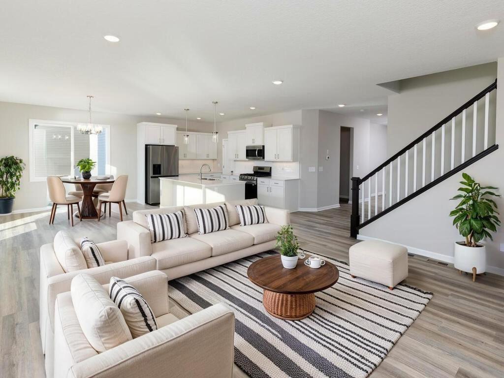 VIRTUALLY STAGED PHOTO OF A DIFFERENT HOME WITH SIMILAR PLAN. FINISHES MAY VARY. Great Room