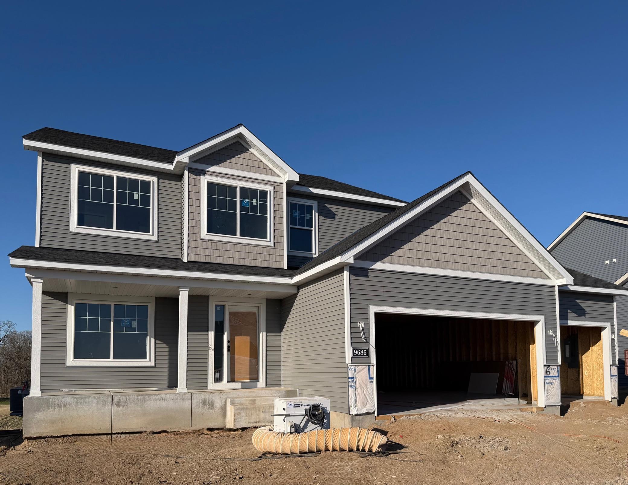 9686 32nd St NE - Home will be ready for move-in on 6/9/2026! Garage doors and stone accents will be installed soon. Sod, Irrigation System, and Front Plantings included.