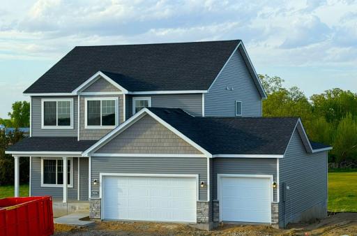 9686 32nd St NE- Spacious 4 Bay Garage! 3 Stalls across the front of the home and 4th Bay tandem behind the 3rd stall. Sod, Irrigation System, and Front Plantings with rock included. Driveway will be installed soon.