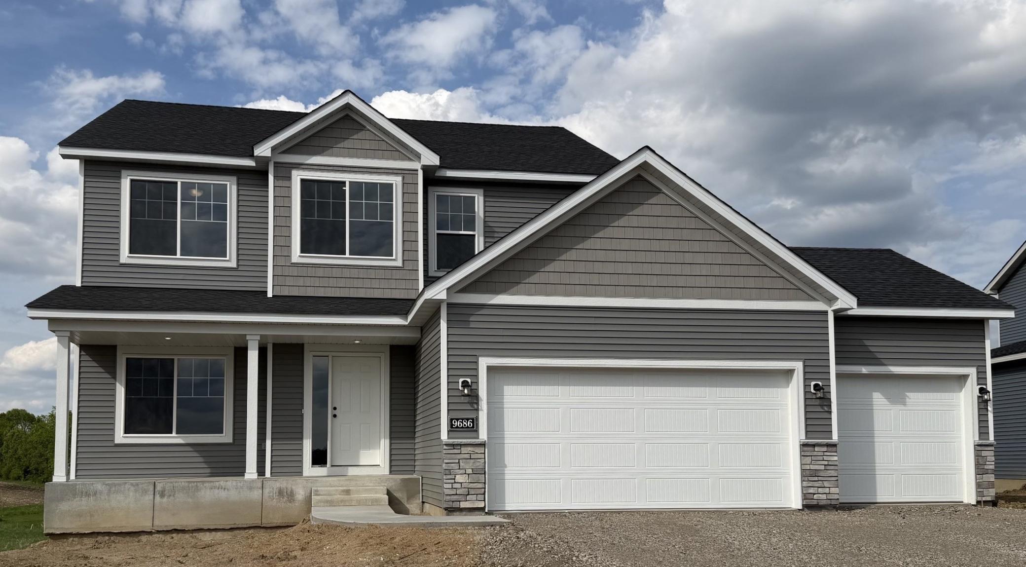 9686 32nd St NE- Home is ready for a Quick Move-in! Highlights include a 4 Bay Garage located on a Walkout Homesite! Sod, Irrigation System, & Front Plantings included. Driveway will be installed soon. Front door will be painted.