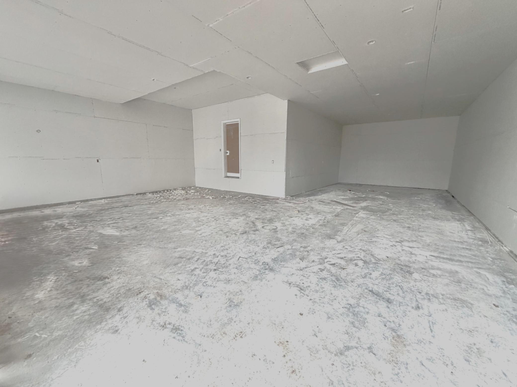 Photo of a different home under construction. Spacious 4 Bay Garage! 3 stalls across the front and 4th bay tandem offering an abundance of storage and work space.