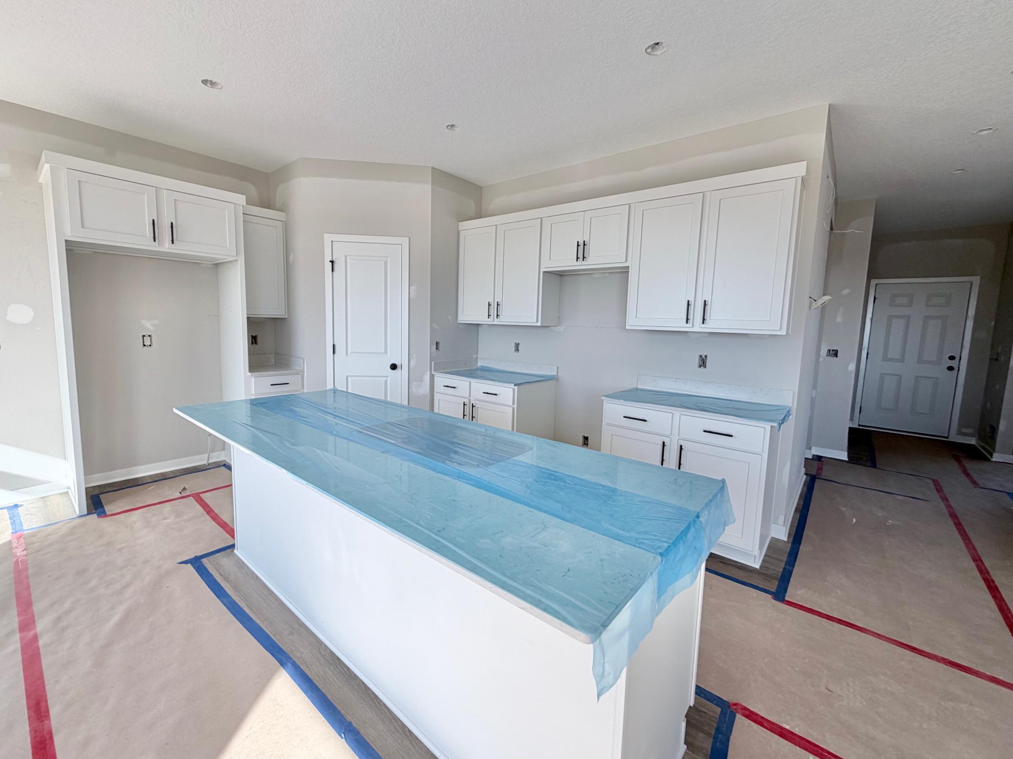 3171 Jandura Ave NE- Kitchen features a spacious center island and walk-in pantry.