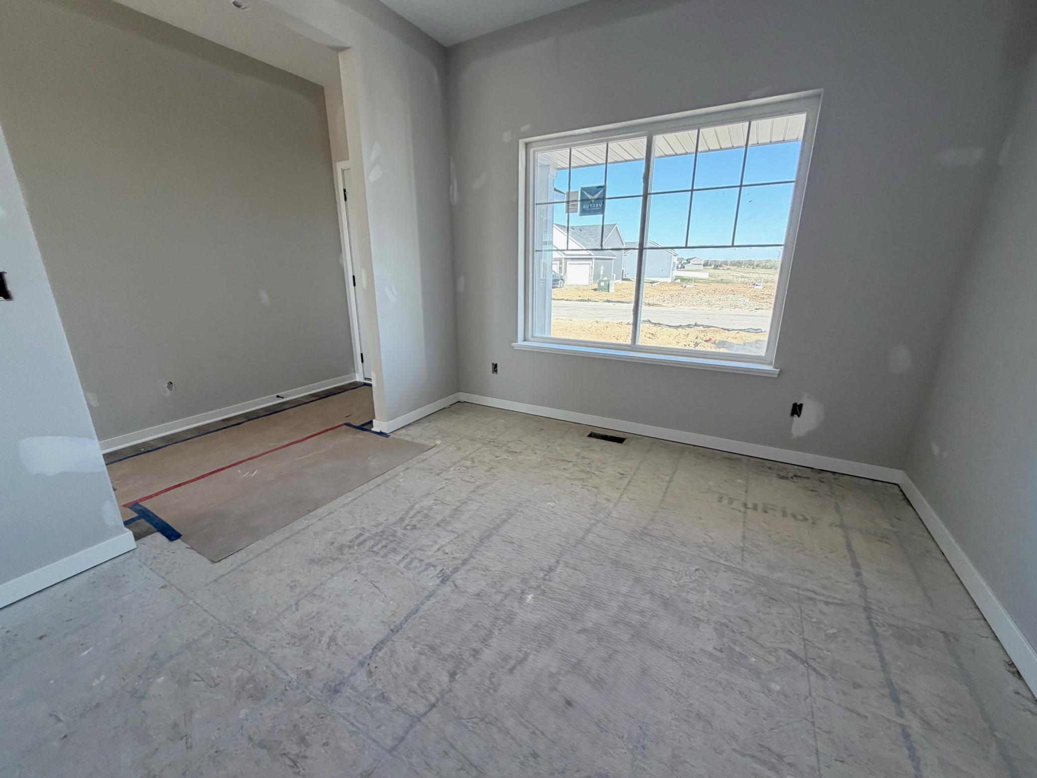 3171 Jandura Ave NE- Main floor Flex Room offer views to the front yard.