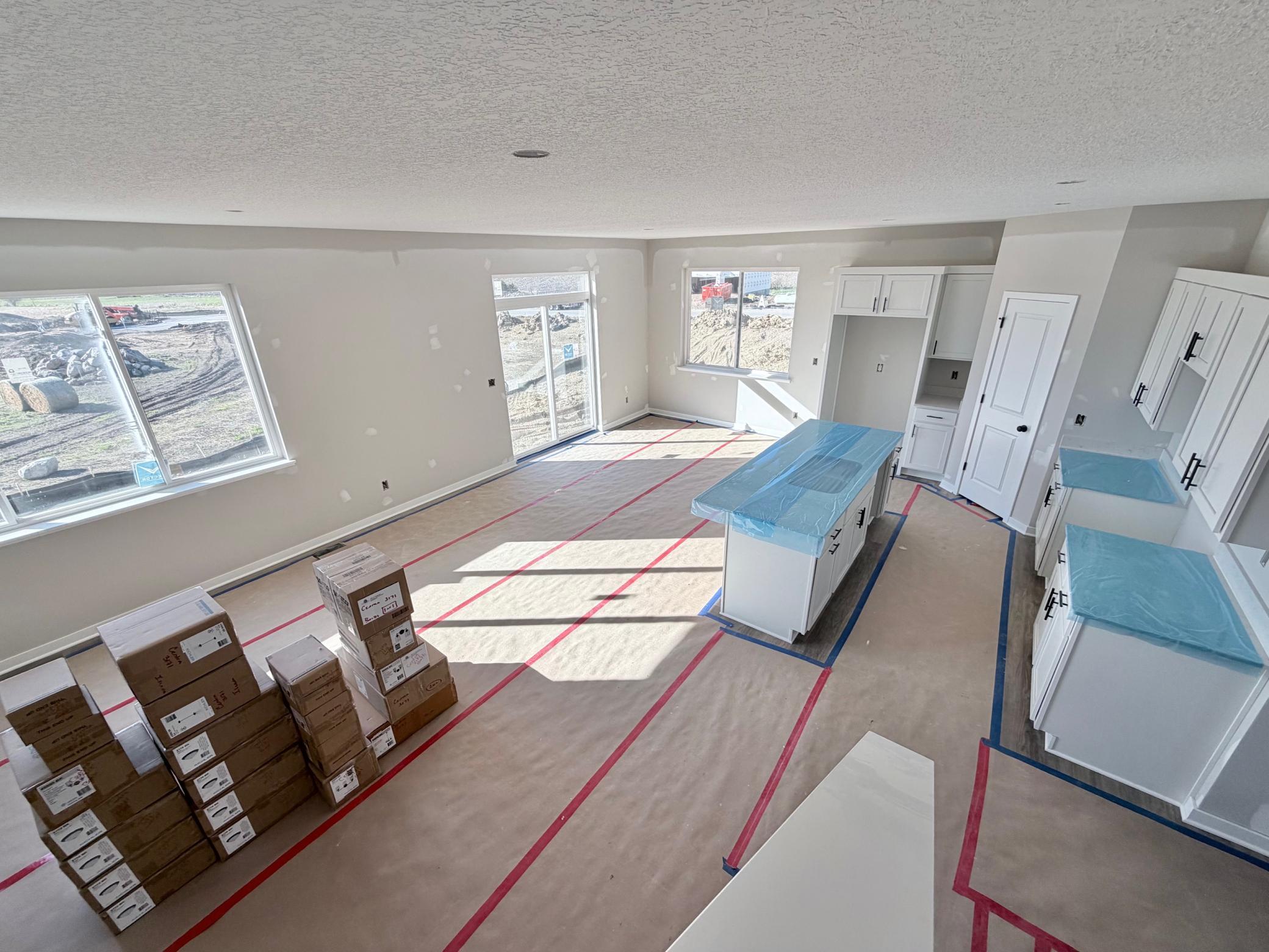 3171 Jandura Ave NE - Staircase view to the main floor featuring an abundance of windows and natural light.