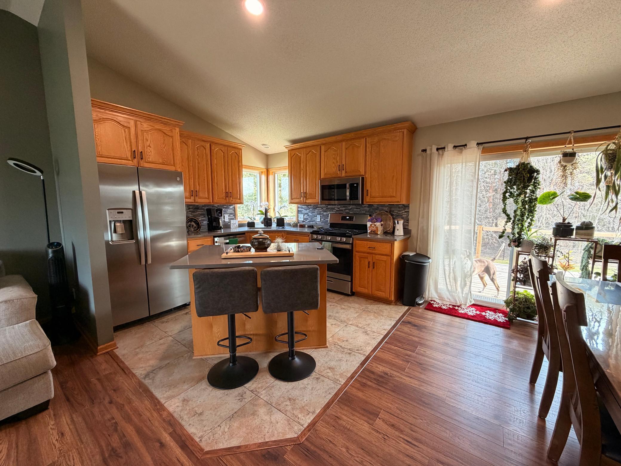 Kitchen with updated appliances and quartz count tops