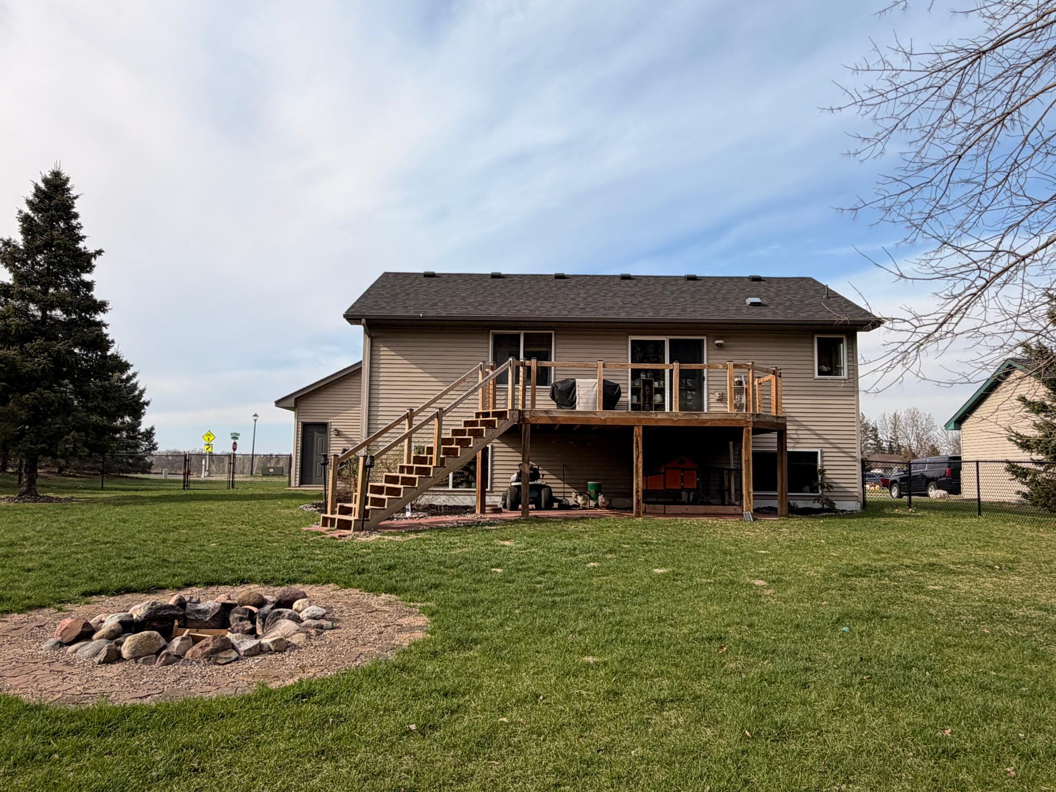 Rear of Home with Newly Updated Deck & Fire Pit