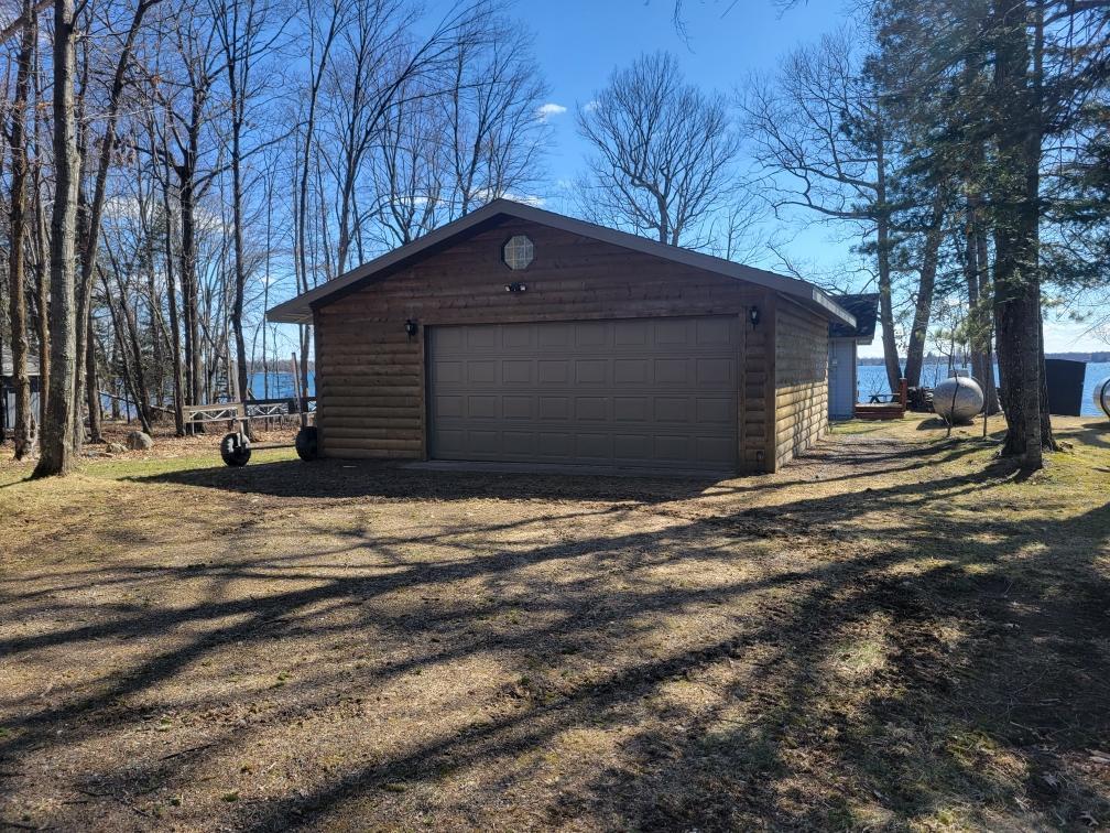 24x24 garage with concrete floor and electricity.
