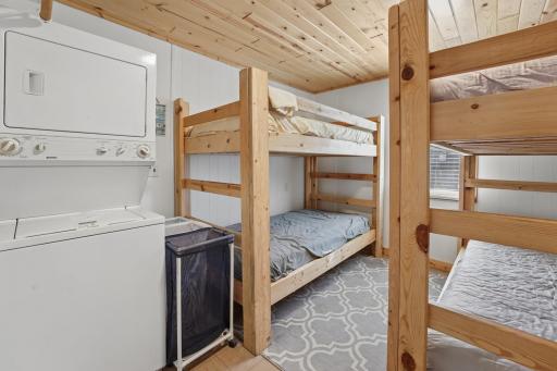 The largest of the 3 bedrooms. Knotty pine ceiling. Bunk beds will stay