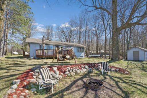 Carved-out firepit area just steps from the lake - the perfect spot to unwind, gather, and take in the water views.