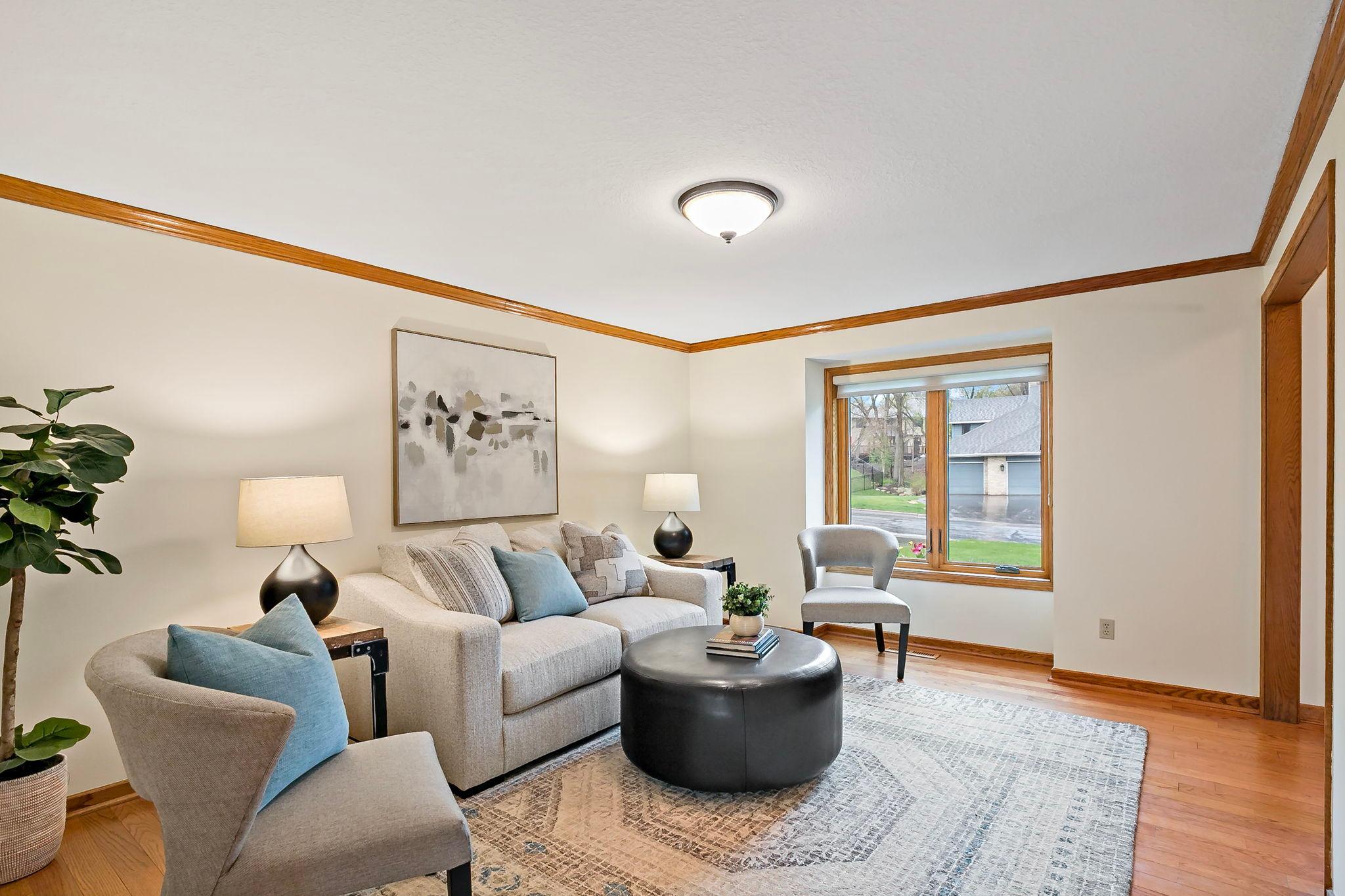 This home has multiple living and entertaining spaces, starting with this lovely sitting room at the front of the home.
