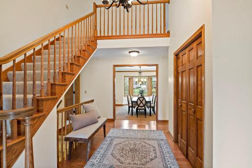 A lovely two-story foyer greets you upon entry.