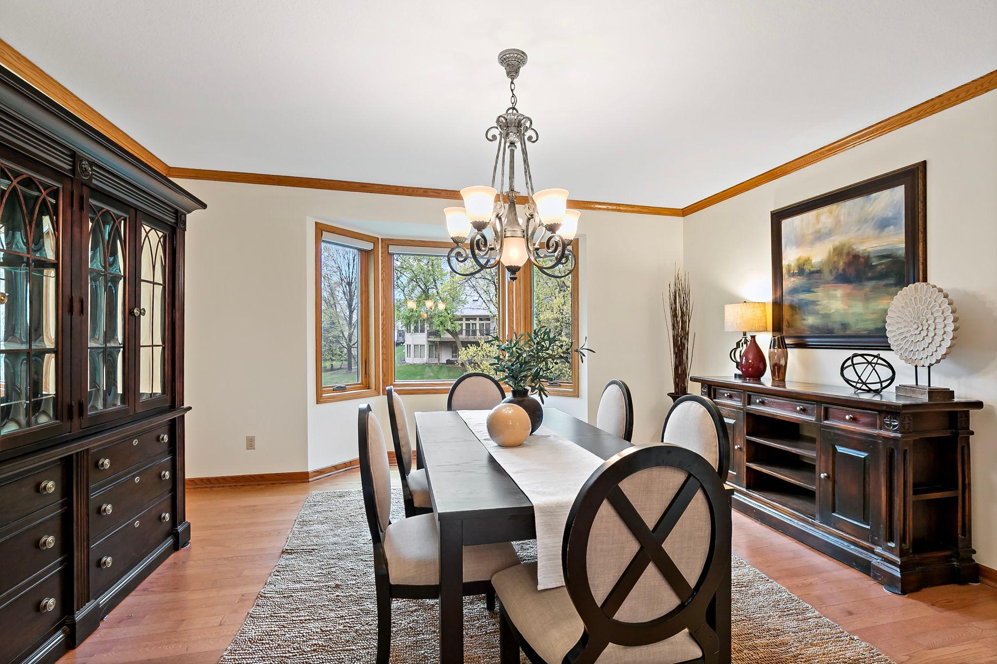 A separate formal dining room overlooks the pond in back.