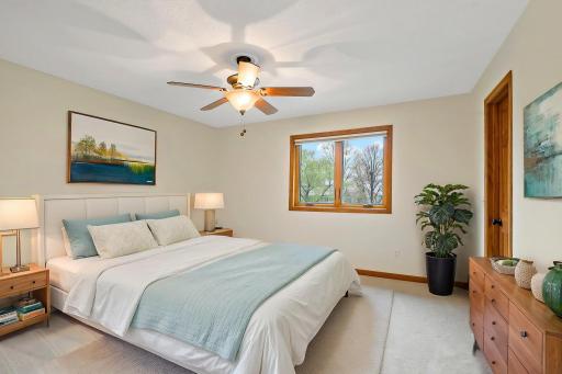Upper level bedroom 2 (virtually staged). All upstairs bedrooms have walk-in closets, and fresh new carpet and paint throughout.