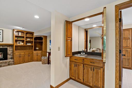 A handy wet bar tucks neatly behind cabinet doors when not needed.