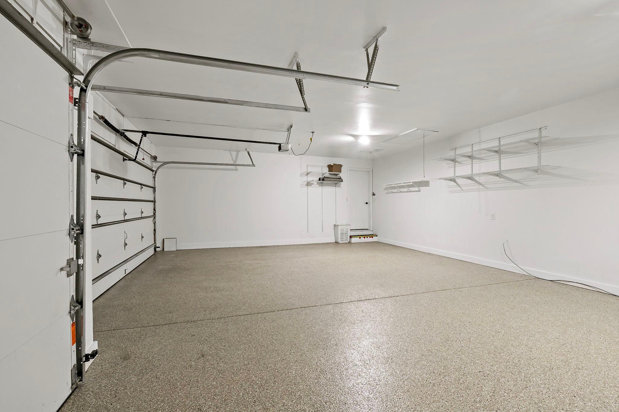 Even the three-car garage is spotless, with a new epoxy floor. And did we mention that the driveway is totally new too?