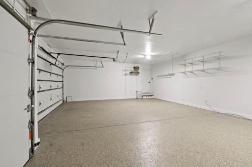 Even the three-car insulated garage is as spotless as the home, sporting a new epoxy floor. And did we mention that the driveway is totally new too?