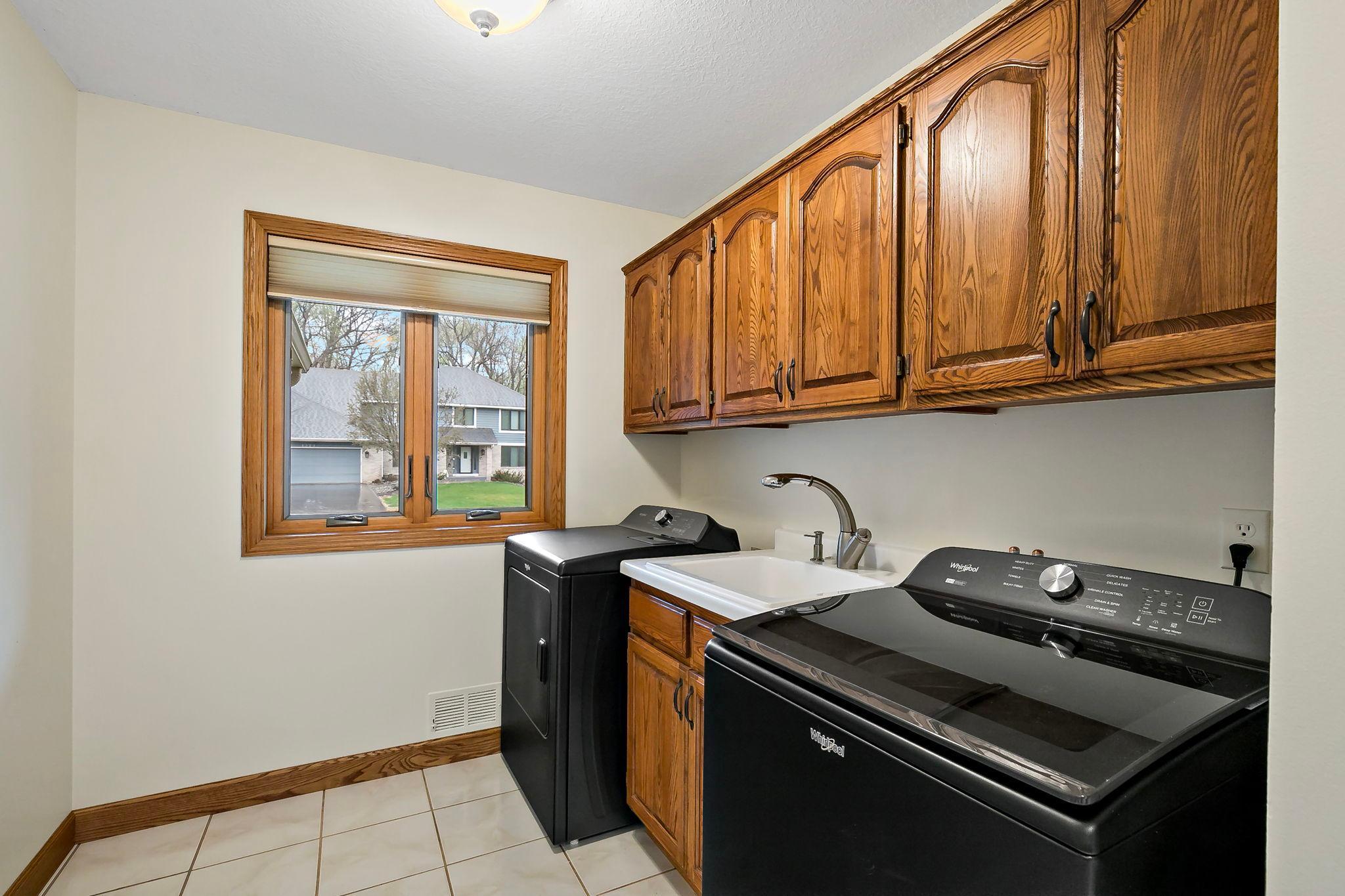 Completing the main level are a laundry room with newer washer-dryer.....