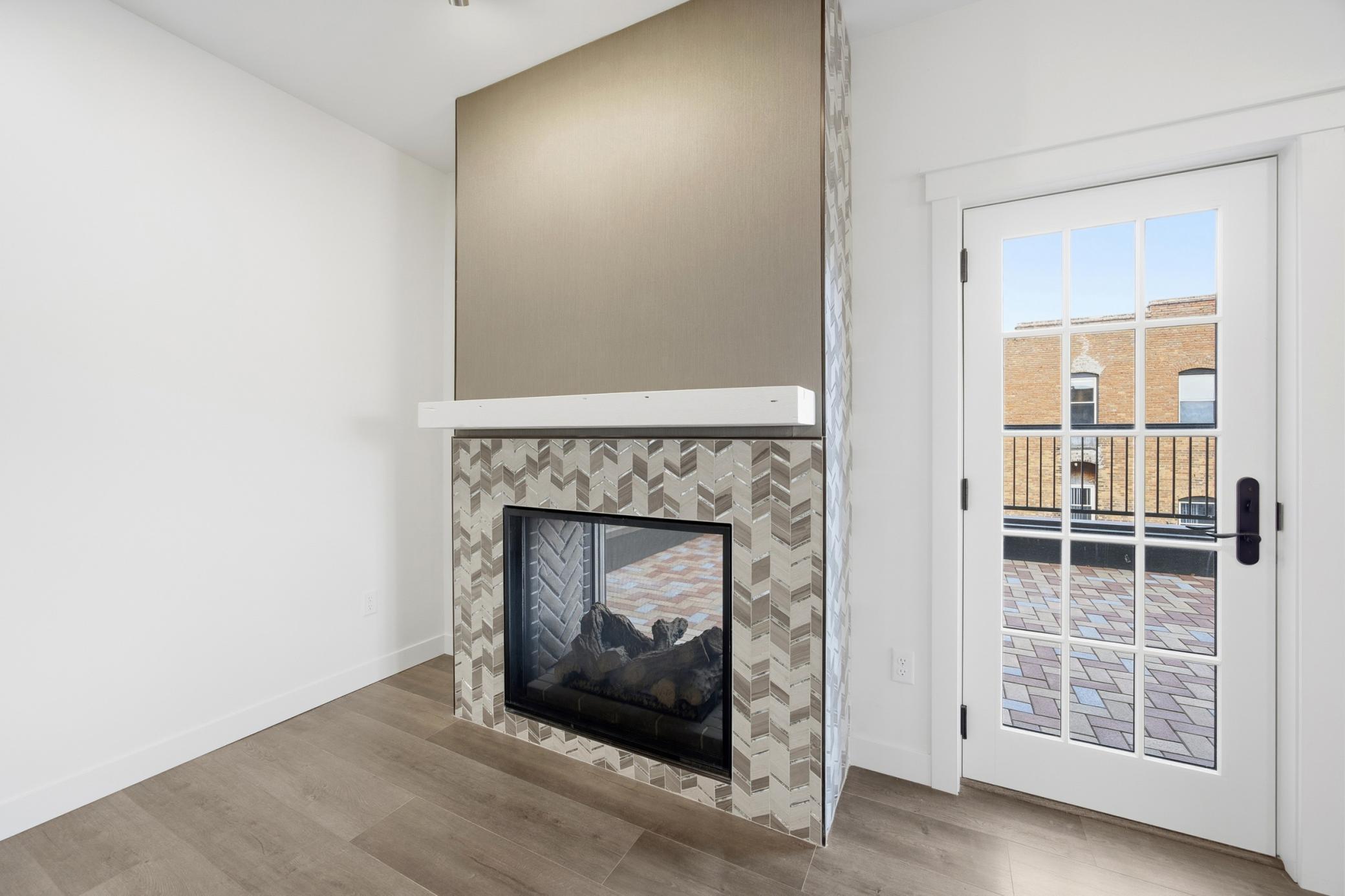 Double-sided Gas Fireplace & Door to Terrace