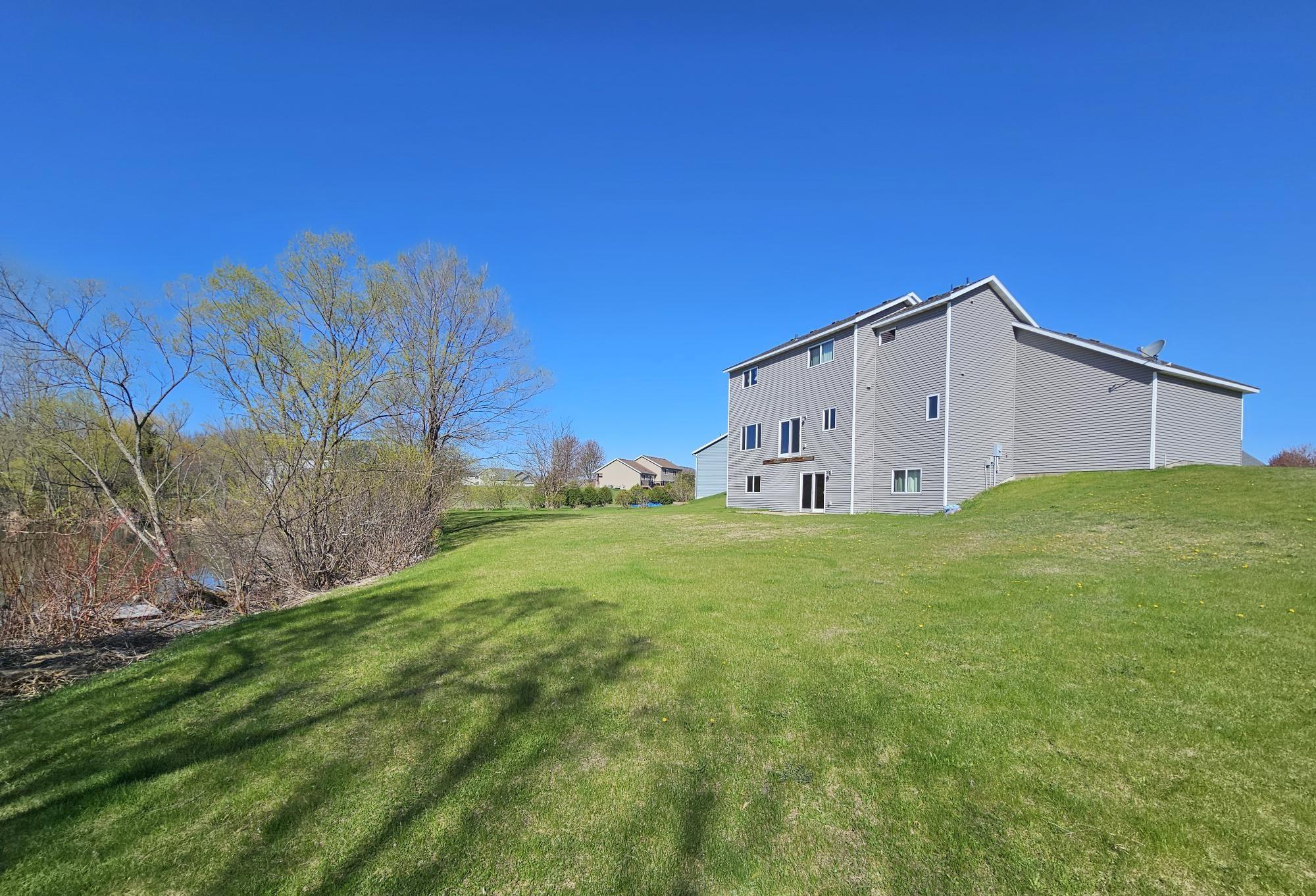This spacious home features a patio and offers the perfect opportunity to create your dream outdoor living space. With plenty of room to add a deck and design your ideal backyard retreat.