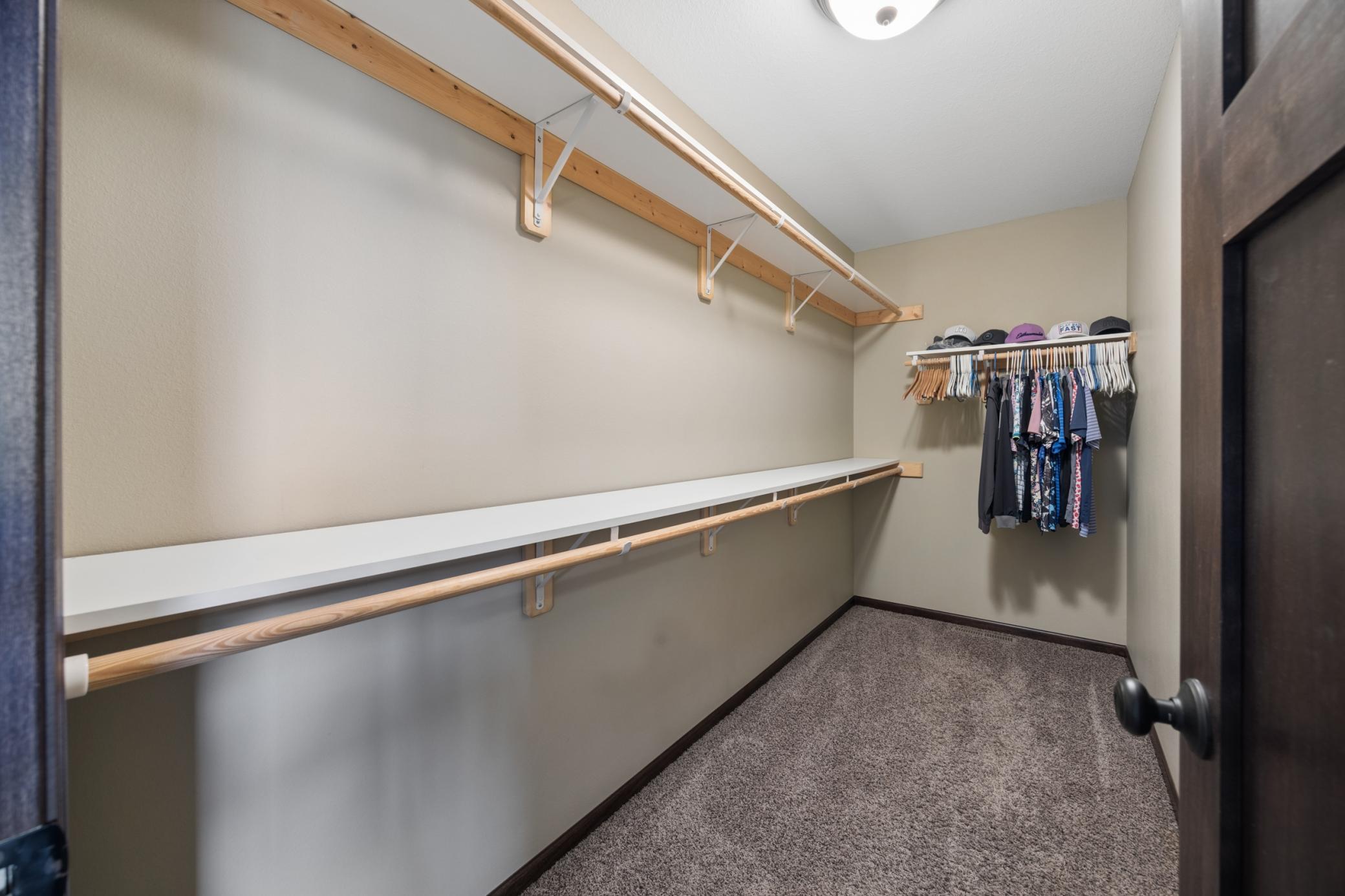 Huge walk-in closet with plenty of room for clothes, shoes and more.