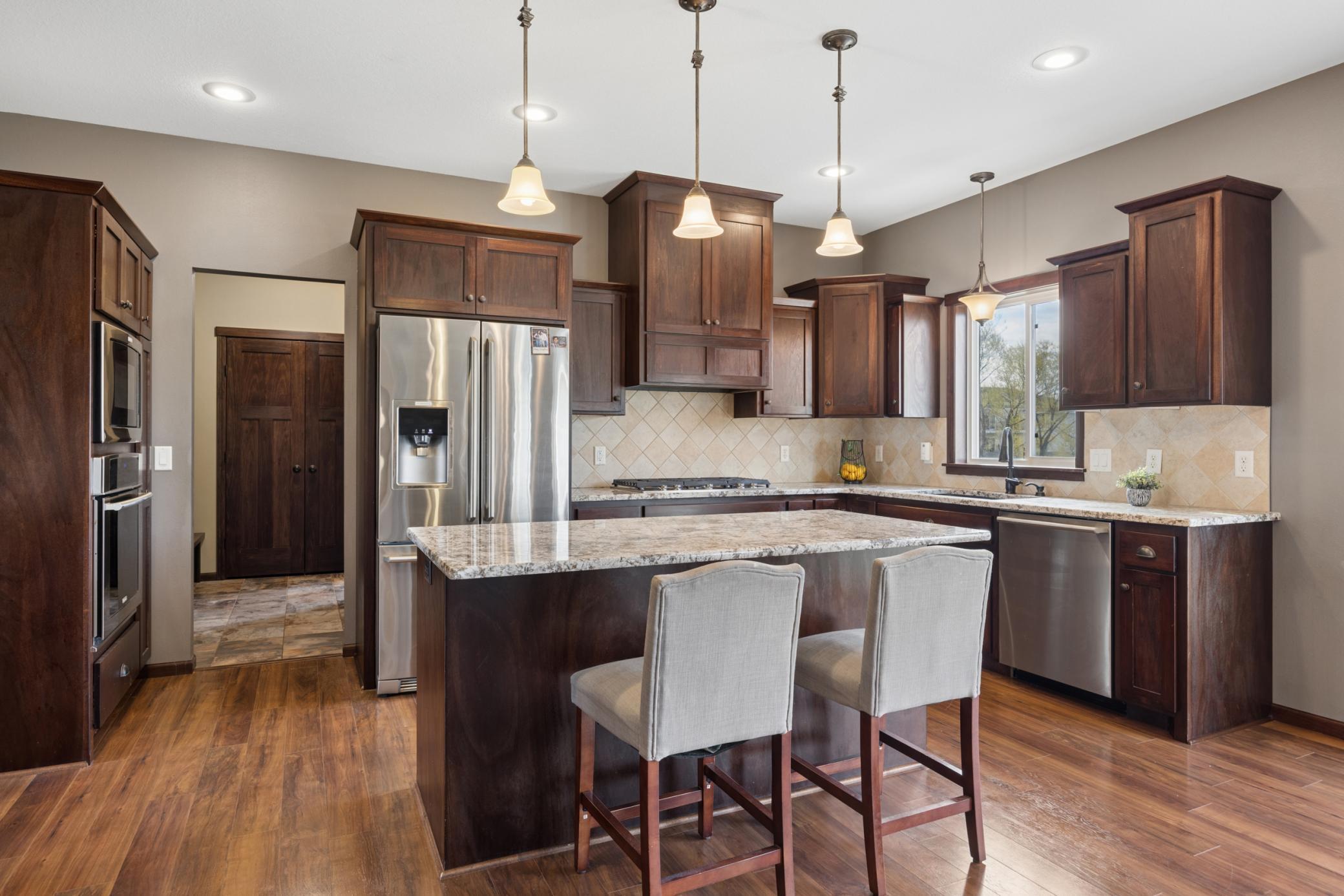 The staggered cabinetry adds style to the already beautiful kitchen