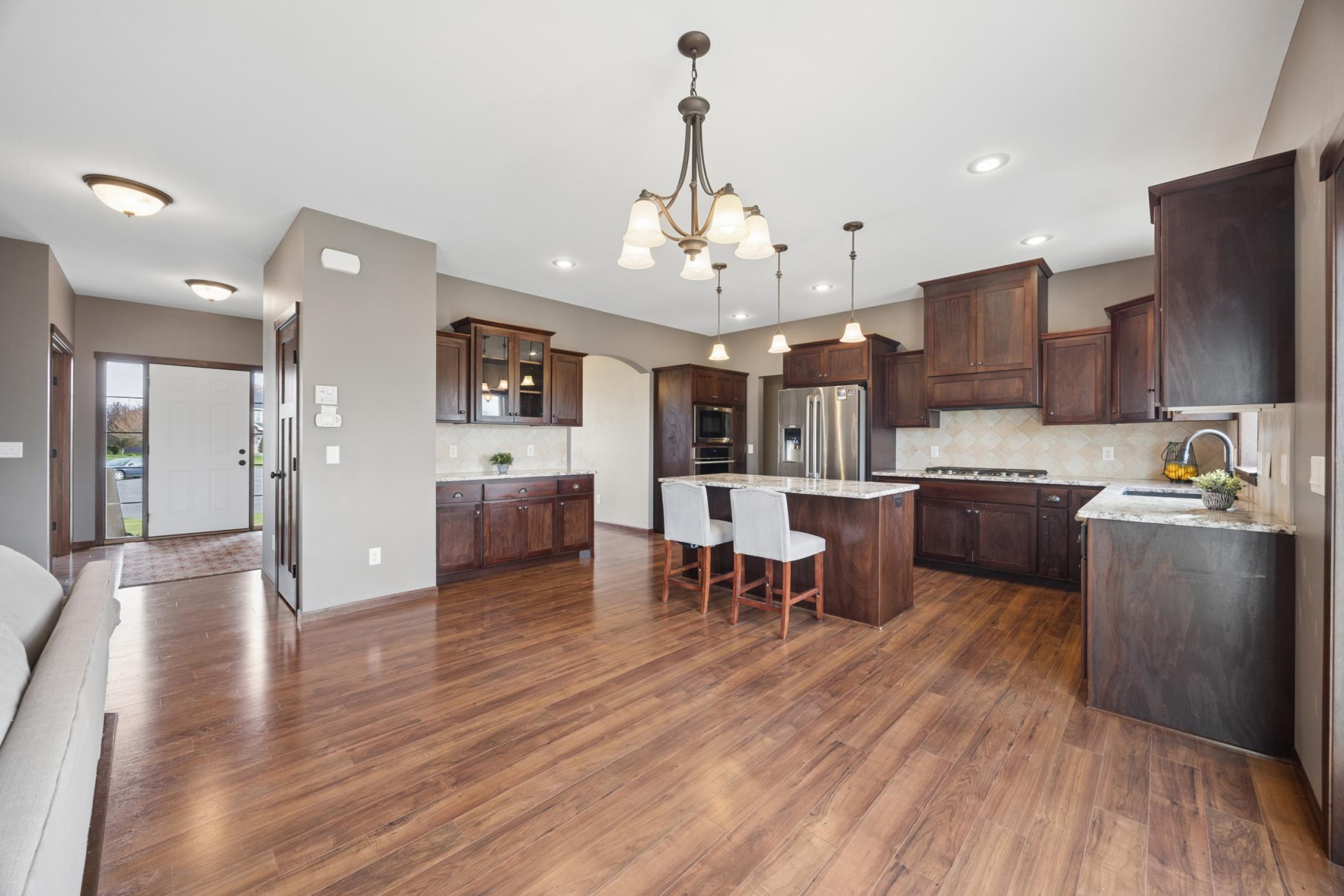 Seamless flow into both informal and formal dining spaces provides flexibility for everything from weeknight dinners to holiday hosting.