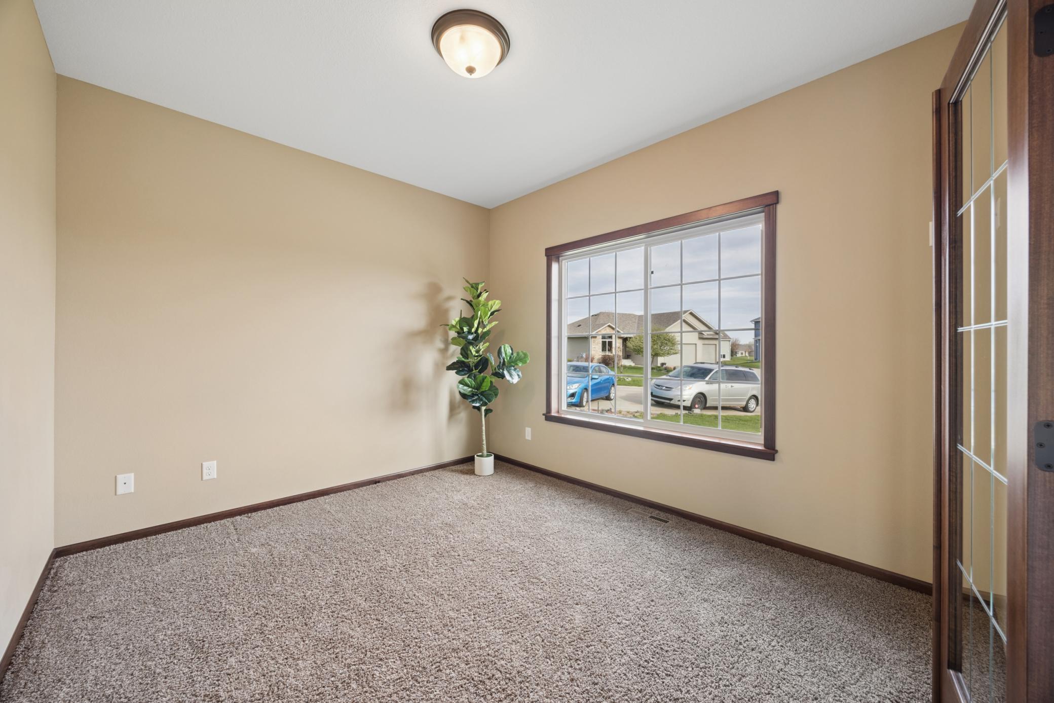 Beautiful home office just inside the front door, complete with French Doors