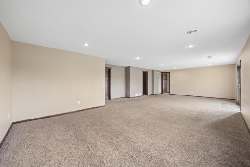 Recessed lighting and plenty of room for large furniture or even a pool table.